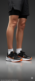 Nike ZoomX running shoes black and orange studio shot side view